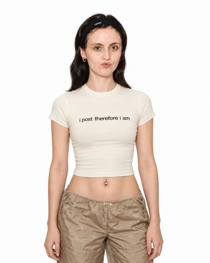 Model wearing I Post Therefore I Am cream baby tee, front view